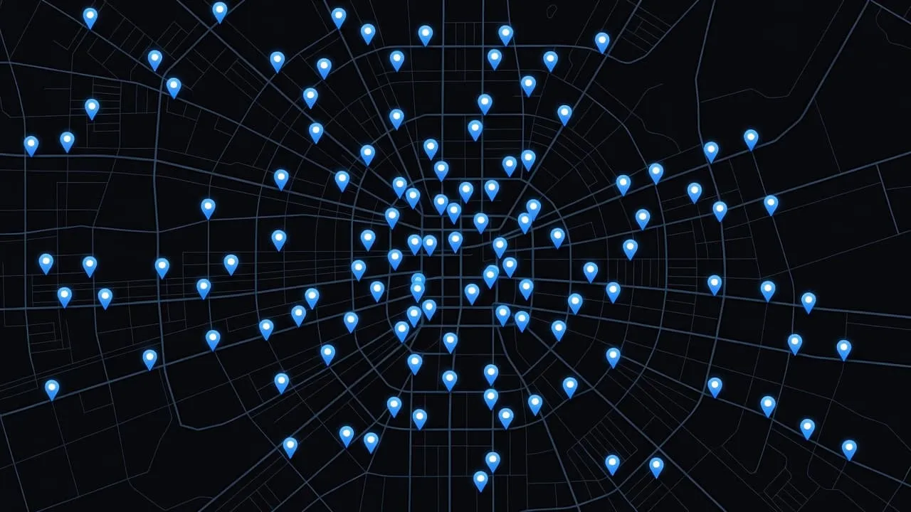 Numerous bright blue glowing location markers dot the dark, detailed city grid. The cluster highlights high-density business hubs, with vibrant light contrast against the deep charcoal background of the streets.